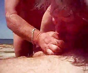 Help Him Cum At The Beach