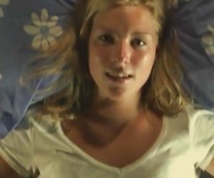 Petite blonde plays with herself on bed