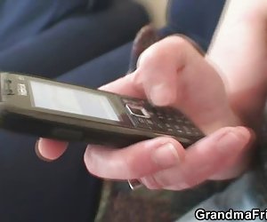 Nasty granny plays with her pussy then takes two cocks