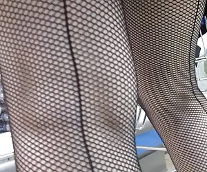 Seamed fishnet stockings in market
