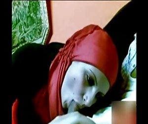 arab girl with red hijab sucking dick