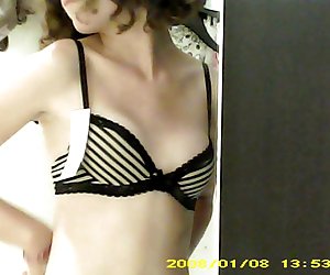 Dressing room hidden cam - Topless brunette with small boobs