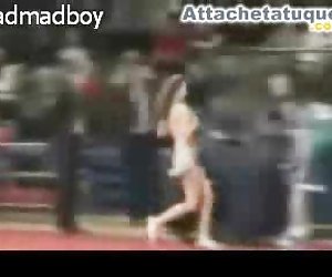 Cheerleader removes her top during a basketball game